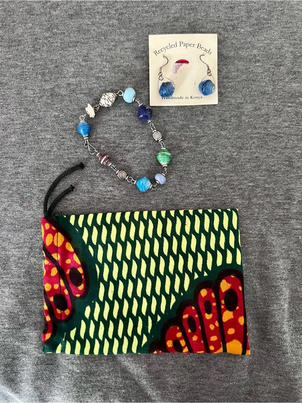 Recycled paper beaded bracelet and earring set. Handmade in Kenya